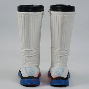 White knee-high boots with black tops and blue soles on a gray background