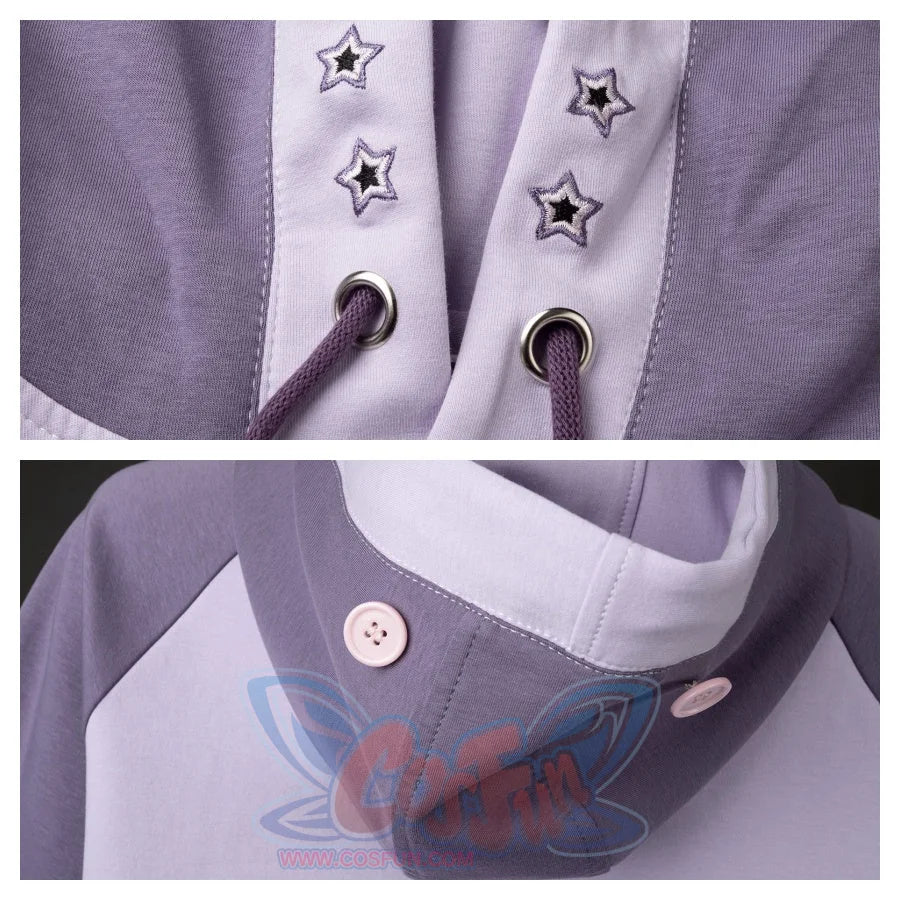 Details of the hood&#39;s drawstring area with star embroidery and the buttons that secure the bunny ears. Shows the craftsmanship and design details.