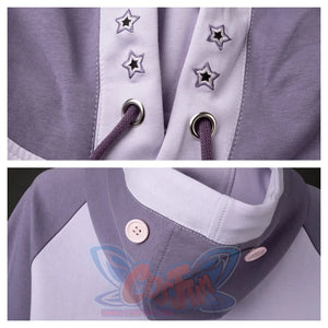 Details of the hood's drawstring area with star embroidery and the buttons that secure the bunny ears. Shows the craftsmanship and design details.