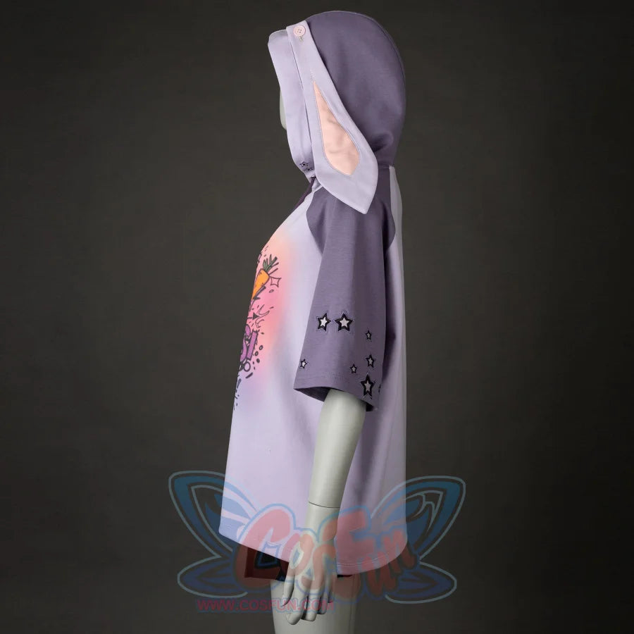 A side view shows the hoodie&#39;s shape, the graphic print, star - decorated sleeves, and the hood with bunny ears. It has a relaxed, casual style.