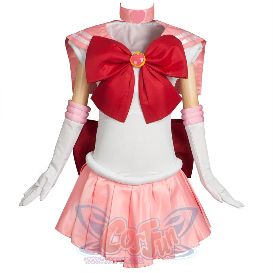 Displays the complete Kid Cosplay Sailor Chibi costume, featuring a white bodice, pink sailor collar, large red bow, arm cuffs, gloves, and a pink pleated skirt, along with a pink choker.