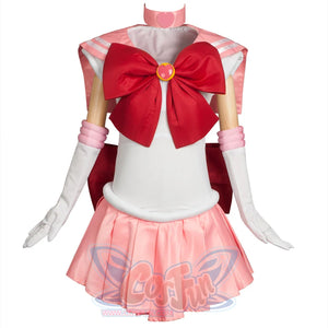 Displays the complete Kid Cosplay Sailor Chibi costume, featuring a white bodice, pink sailor collar, large red bow, arm cuffs, gloves, and a pink pleated skirt, along with a pink choker.
