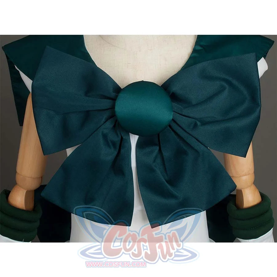 Close - up of the large dark green bow with a round center on the front of the costume, showcasing decorative details.