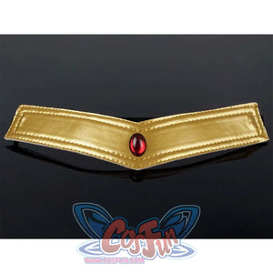 Close - up of the gold - colored brooch with a red gem of the Kid Cosplay Sailor Pluto costume.