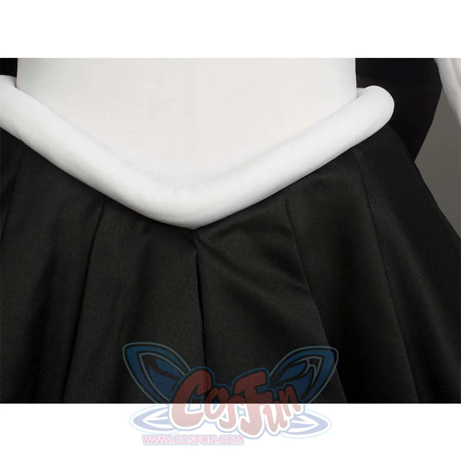 Close - up of the white waist trim and black pleated skirt, highlighting the waist and skirt design.