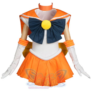 Displays the complete Kid Cosplay Sailor Venus costume, featuring a white bodice, orange sailor collar, large blue bow, arm cuffs, gloves, and an orange pleated skirt.