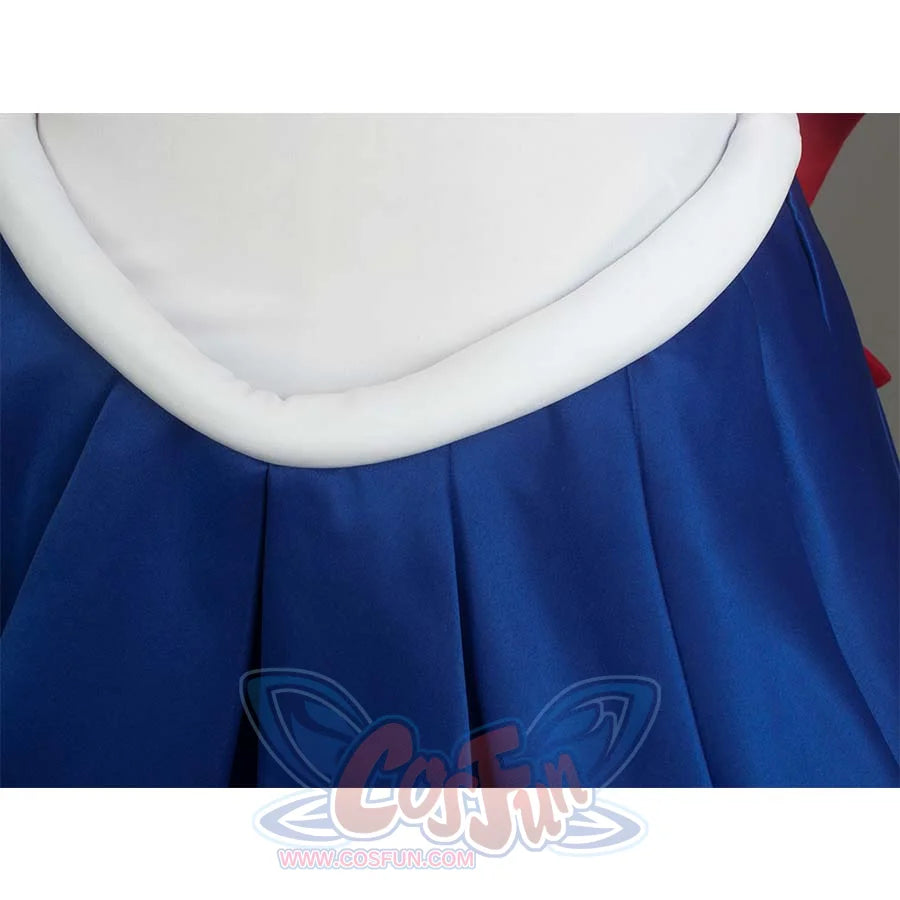 Close - up of the white waist trim and blue pleated skirt, highlighting the waist and skirt design.