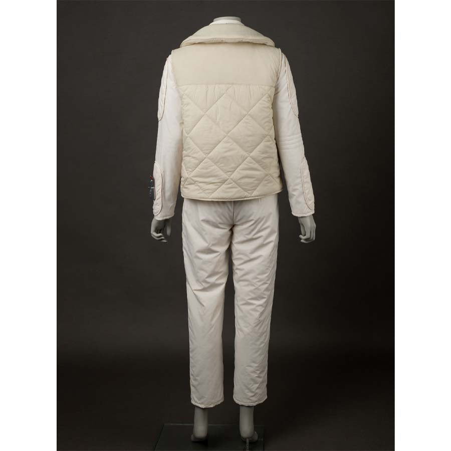 Back view, showcasing the quilted pattern of the vest and jumpsuit. Highlights the hood and the overall back design.