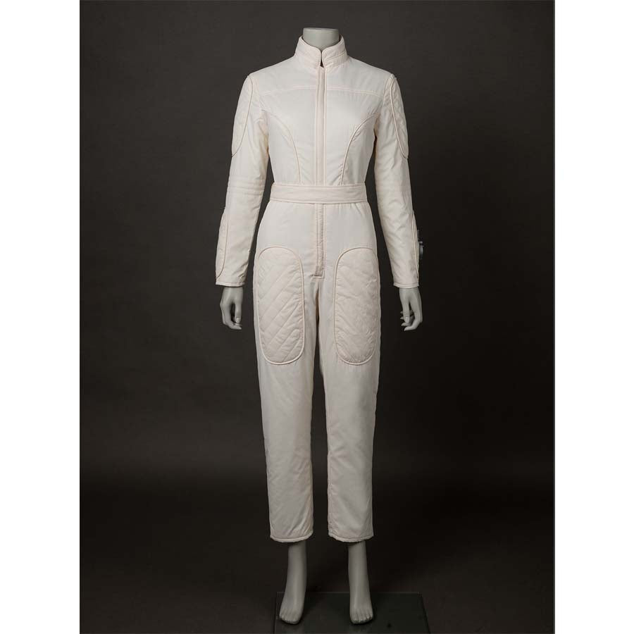 Front view of the beige jumpsuit alone, featuring a belted waist and quilted pockets. Shows the jumpsuit&#39;s design without the vest.