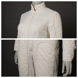 Features the front of the beige jumpsuit, highlighting the quilted pockets and overall design. Shows two views of the jumpsuit’s front.