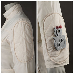 Shows the shoulder pad of the beige jumpsuit, with and without the attached accessory. Highlights the pad’s design and the accessory’s features.