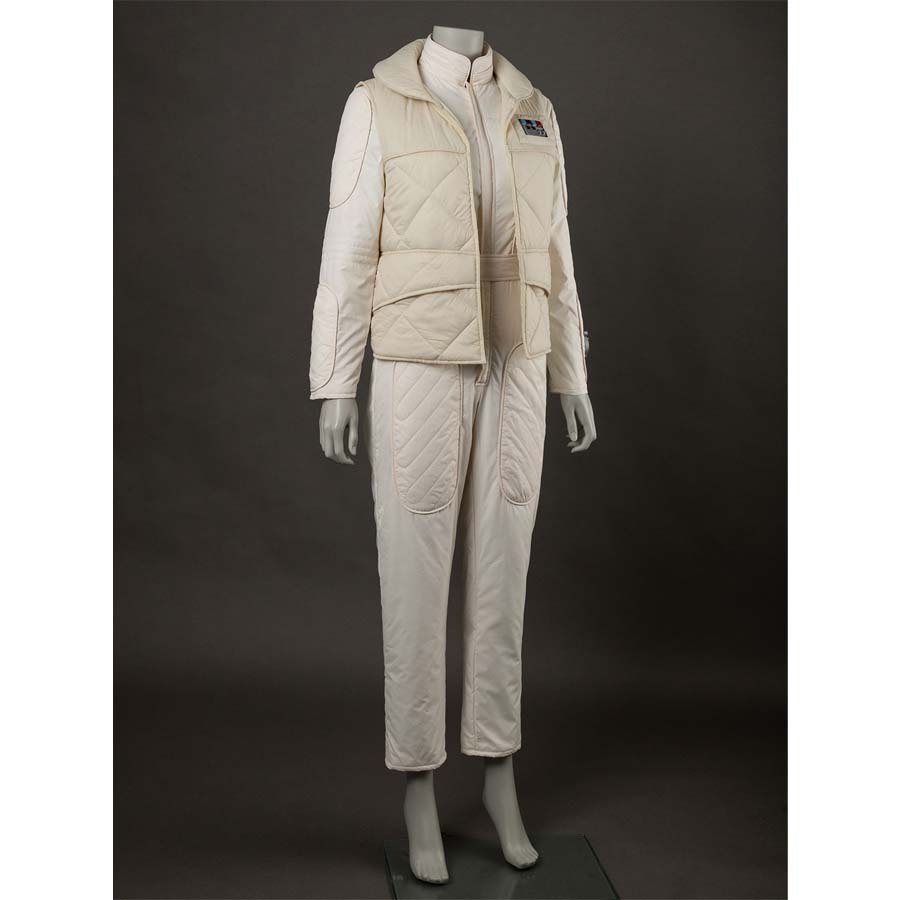 Side view with a focus on the vest&#39;s structure. Shows the front pockets and the way the vest fastens over the jumpsuit.