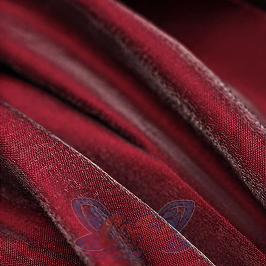 Macro detail of crimson velvet fabric with visible seam stitching from the Miss Pomegranate Little Girl cosplay costume