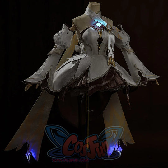 Genshin Impact Traveler Lumine cosplay dress centers a glowing chest gem against puff sleeves and gauntlets.