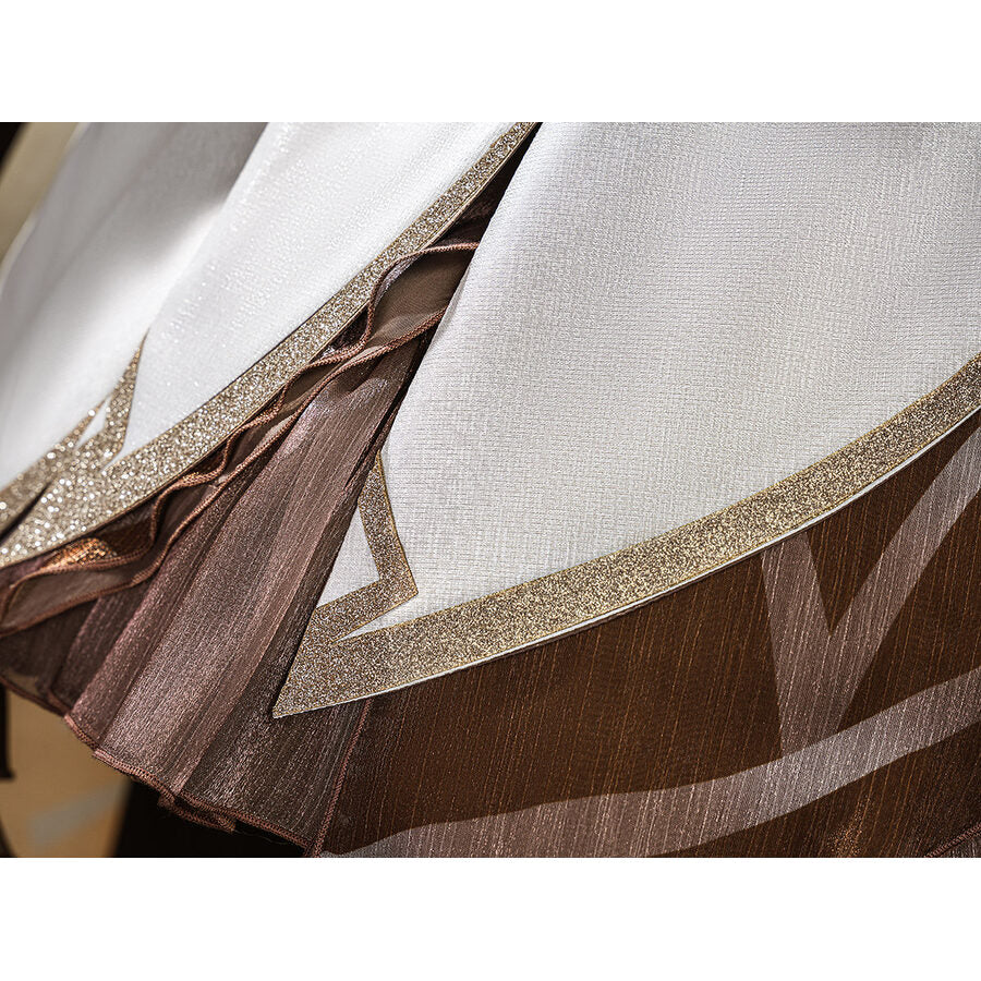 Lumine cosplay costume skirt fabric close-up showing brown layers with gold glitter trim detail