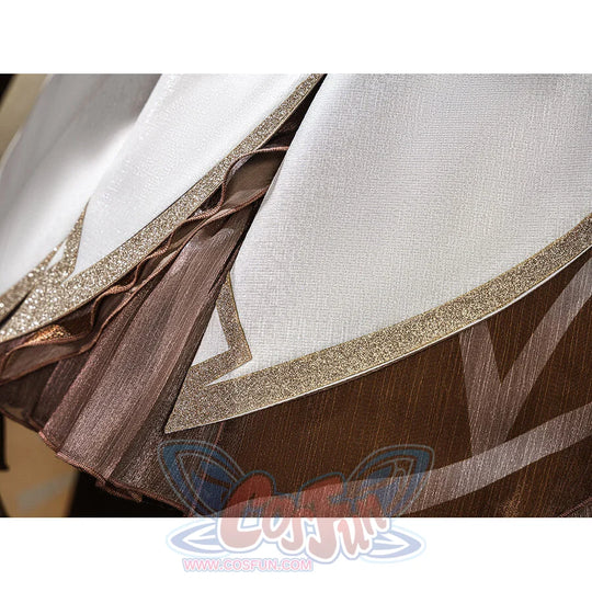Genshin Impact Traveler Lumine cosplay skirt layers gold glitter trim over brown pleated underskirt and sheer overlay.