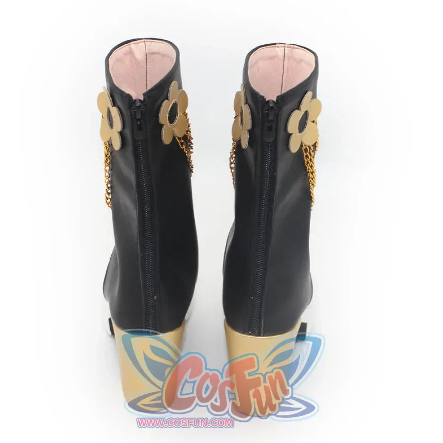 Rear display of Mira cosplay boots, highlighting the zippers, gold flower accents, and chain decorations on the black and white design.