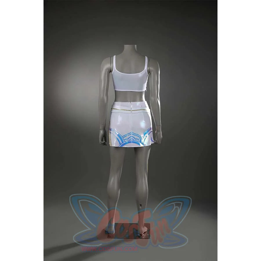 The simple back design of the white undergarments lets the blue iridescent patterns take center stage, with clean seams that avoid overcomplicating the look.