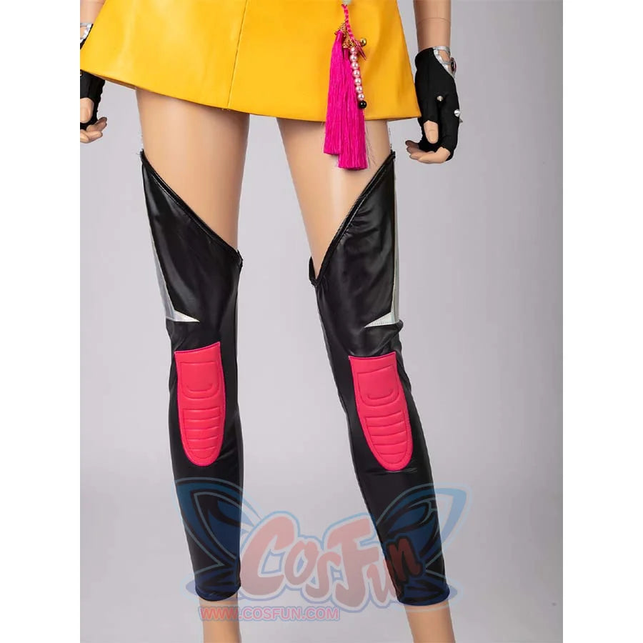 Close - up of black leg armor with pink accents, worn with Mira’s yellow cosplay skirt.