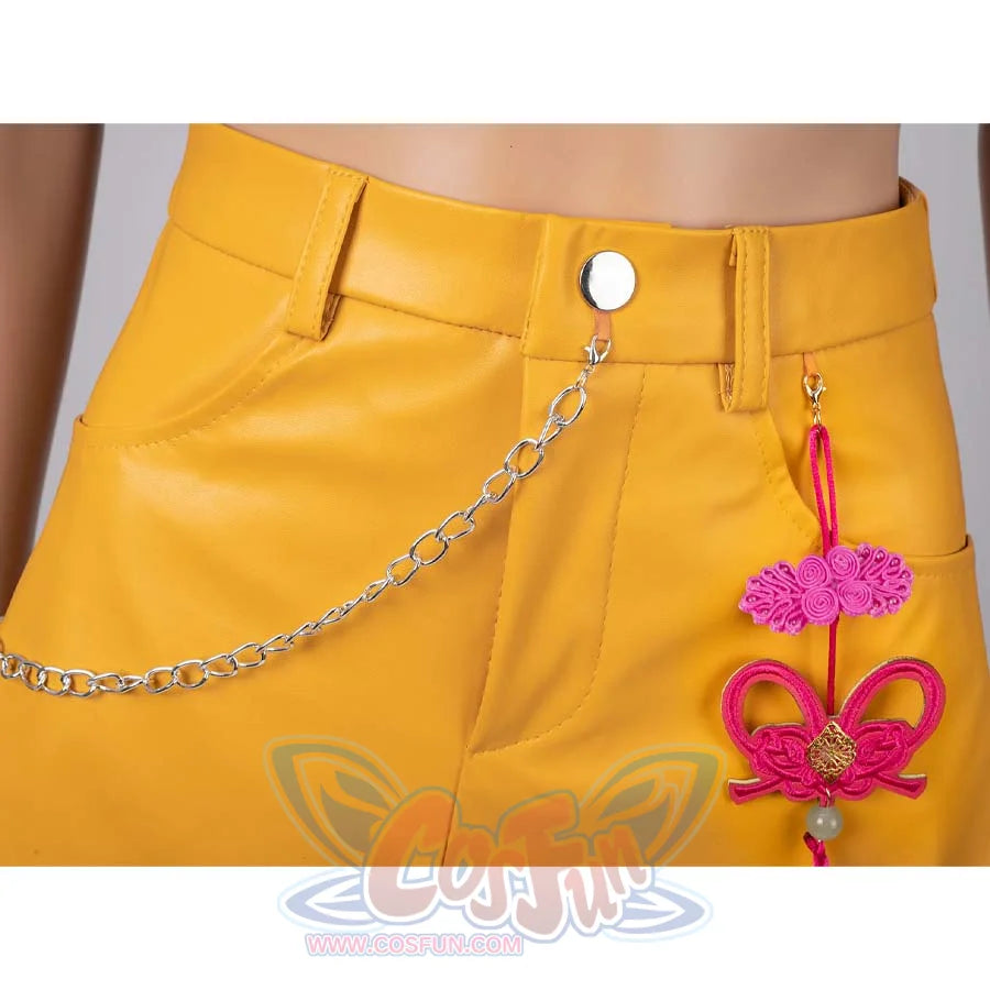 Close - up of a silver chain and pink decorative ornament on Mira’s yellow cosplay skirt.