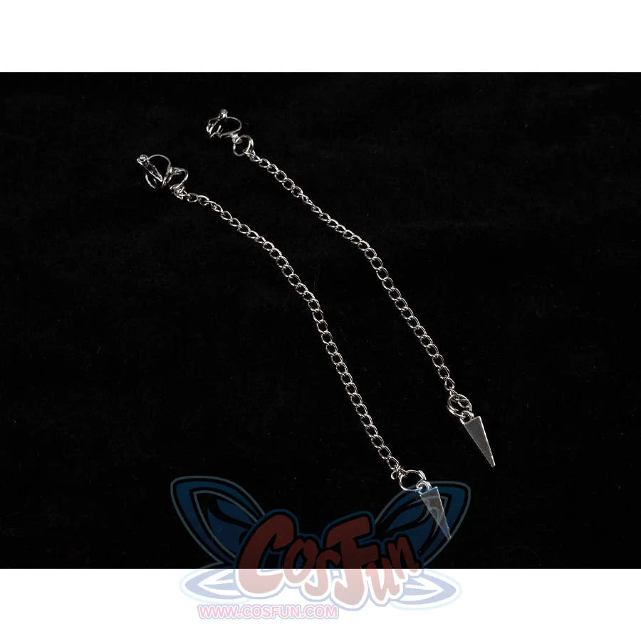Close - up of two silver chains with pointed pendants, part of Mira’s cosplay accessories.