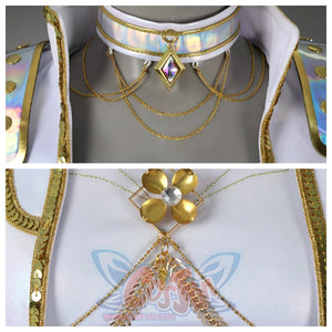 Displays a choker with iridescent finish and layered gold chains, topped with a gem - set pendant, along with a gold flower - shaped brooch on a white fabric.