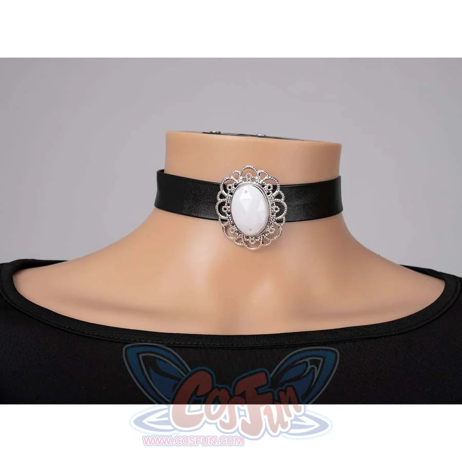 Close - up of a black leather choker with an ornate silver frame and white gem, part of Mira’s cosplay costume.