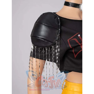 Close - up of a black shoulder pad with dangling silver chains on Mira’s black cosplay top.