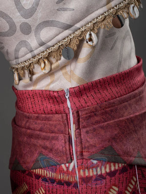 Moana cosplay red tribal skirt showing the side zipper closure and shell coin fringe trim on the top hem above