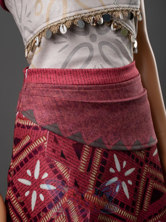 Moana cosplay red tribal skirt close-up showing geometric Polynesian print pattern and shell coin trim at the waistline