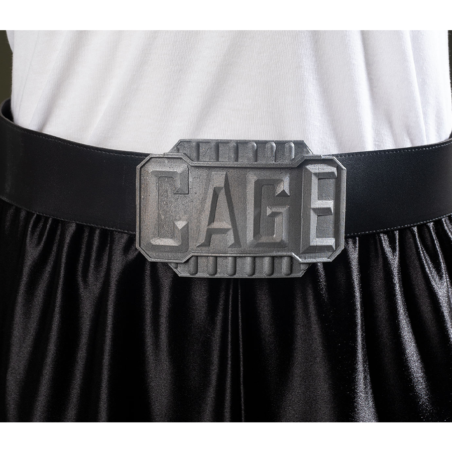 Black belt with a metallic-looking belt buckle embossed with “CAGE”.