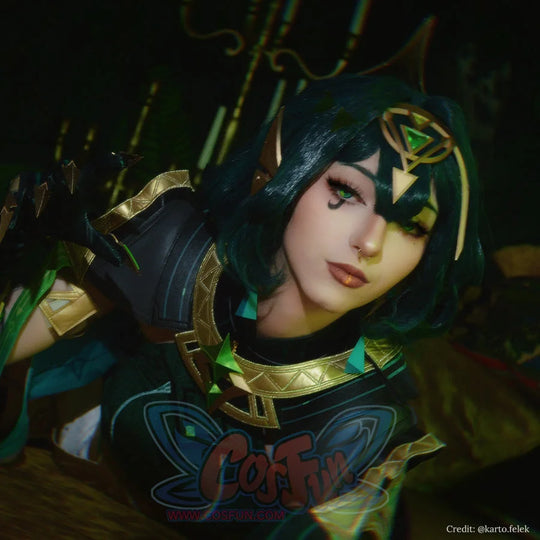 Genshin Impact Nefer cosplay headpiece frames emerald gold geometric accents paired dark armor gold trim.