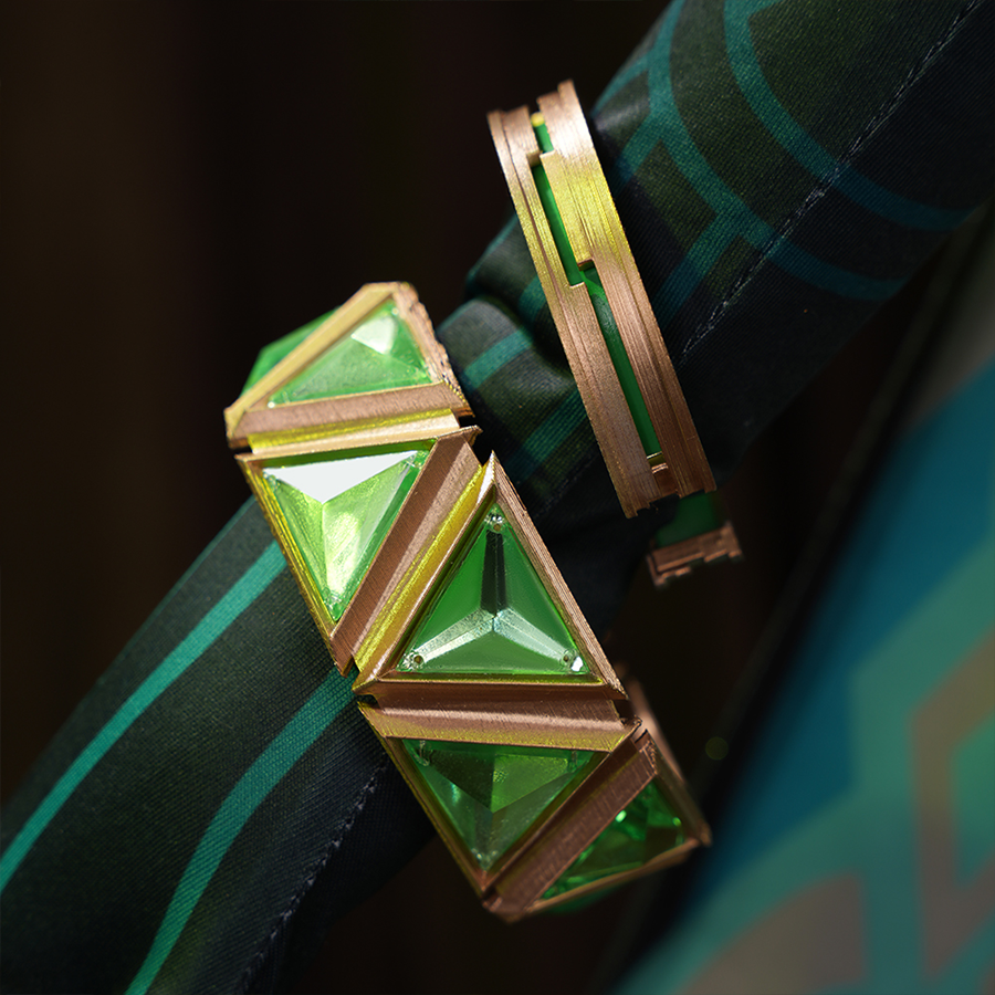Genshin Impact Nefer Cosplay Costume close-up of sleeves, showing golden and green bracelet.