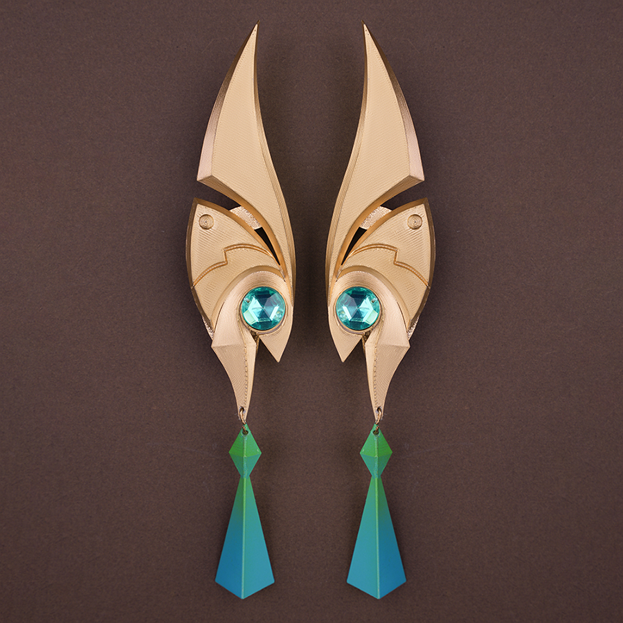 Genshin Impact Nefer Cosplay Costume prop elf ears, mainly golden and green colors.