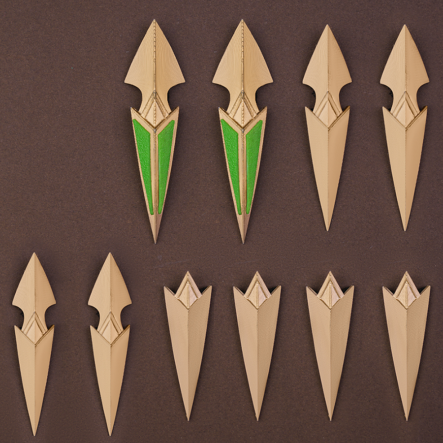 Genshin Impact Nefer Cosplay Costume prop nail art, mainly golden and green colors.