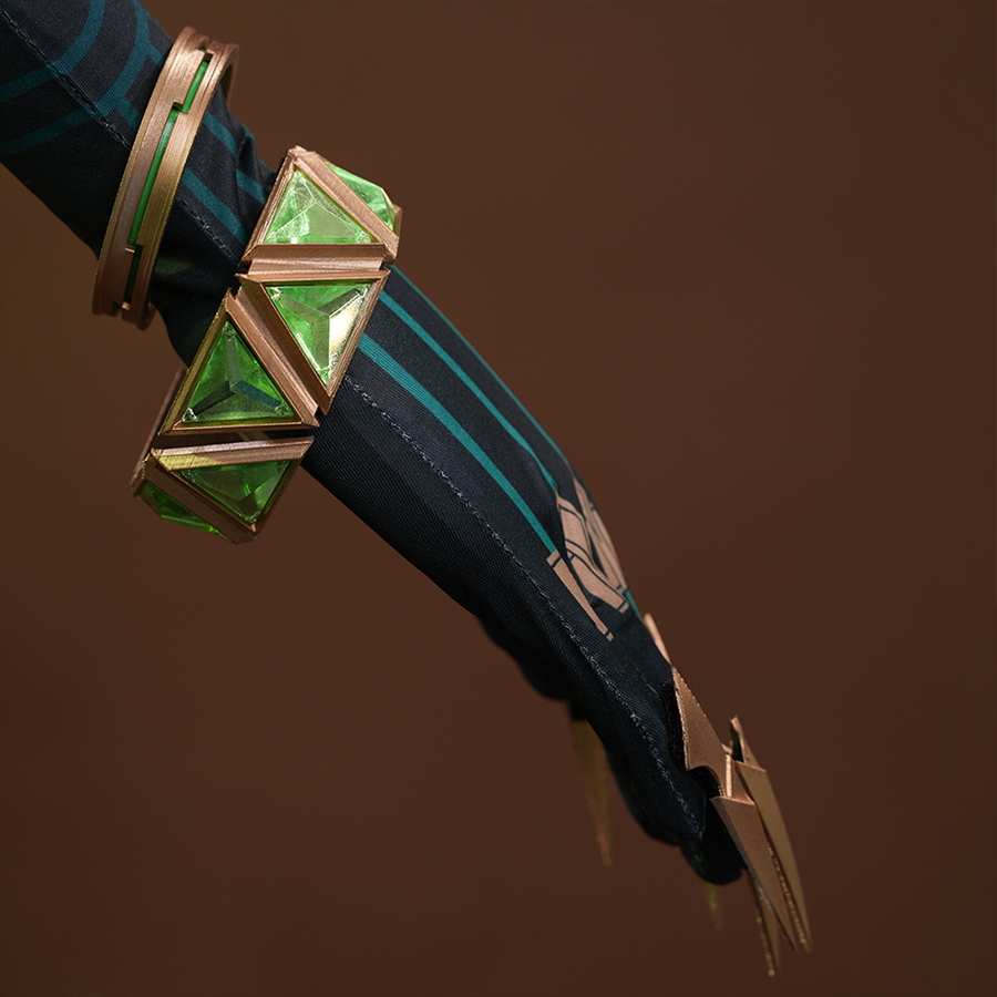 Genshin Impact Nefer Cosplay Costume close-up of sleeves, showing golden nail props and green bracelet.