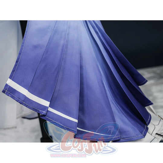 Nicole cosplay costume blue-purple pleated skirt hem close-up, showing flowing fabric texture with white contrast stitching.