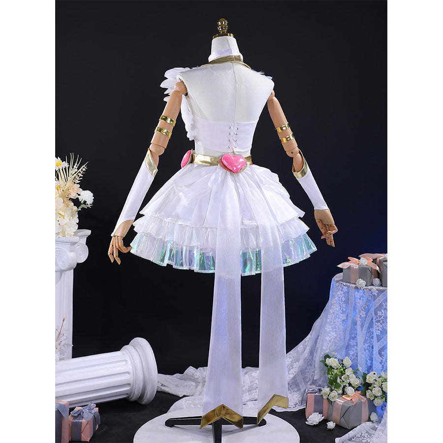 Rear view of Panty cosplay costume with folded wings, white layered skirt, pink bow belt, and golden arm bands