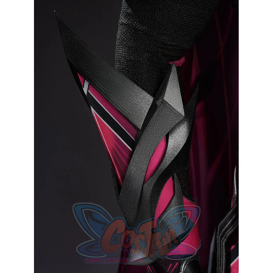 Rerir cosplay chest armor closeup showing dark angular plates with hot pink lining and textured mask