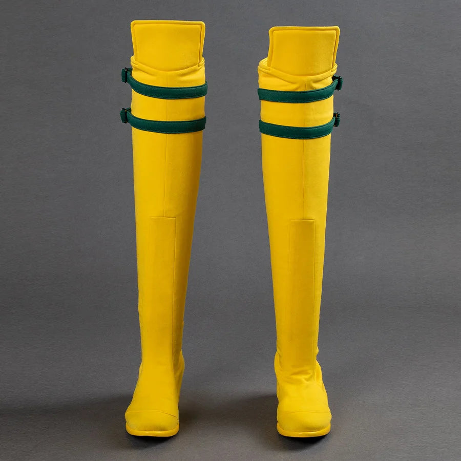 Yellow knee-high Rogue cosplay boots with green straps, front view on gray background