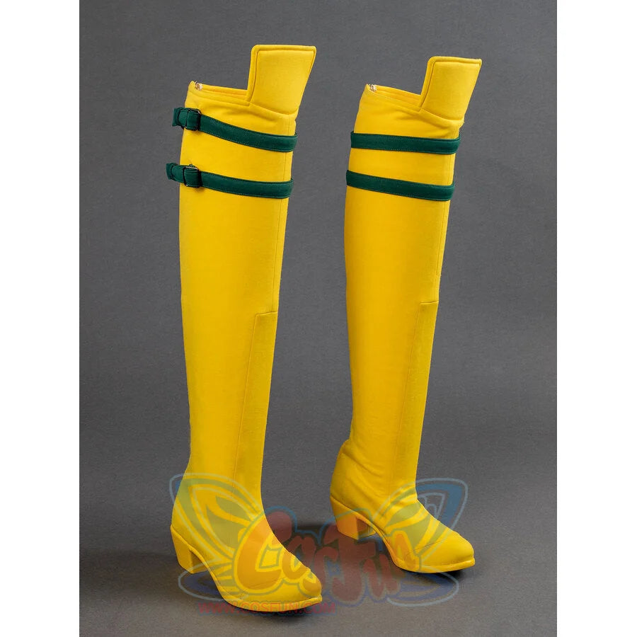 Yellow Rogue cosplay boots with green strap and block heel, side angle view on gray background