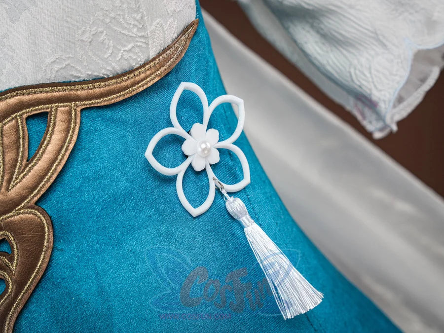 Ruan Mei cosplay costume white flower ornament with pearl center and white tassel against the teal bodice with gold trim.