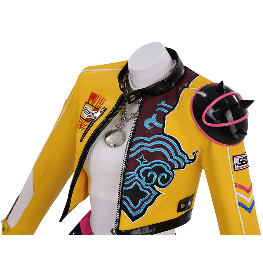  Bright yellow cropped coat with black accents, embroidery, and a spiked shoulder.