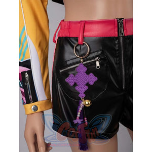 Close - up of the purple tassel accessory with a gold bell on Rumi’s black cosplay shorts.