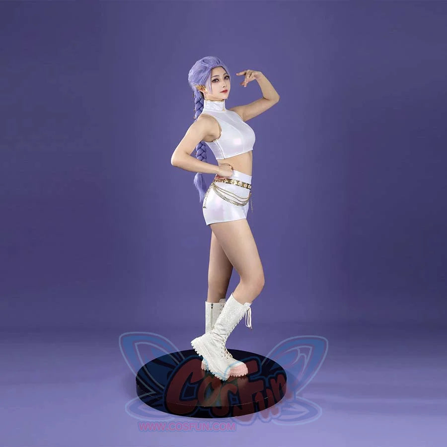 The cosplay features a white, sleeveless, high - neck crop top paired with matching white shorts, accented by a gold chain belt. White lace - up boots complete the Rumi - inspired look against a purple backdrop.
