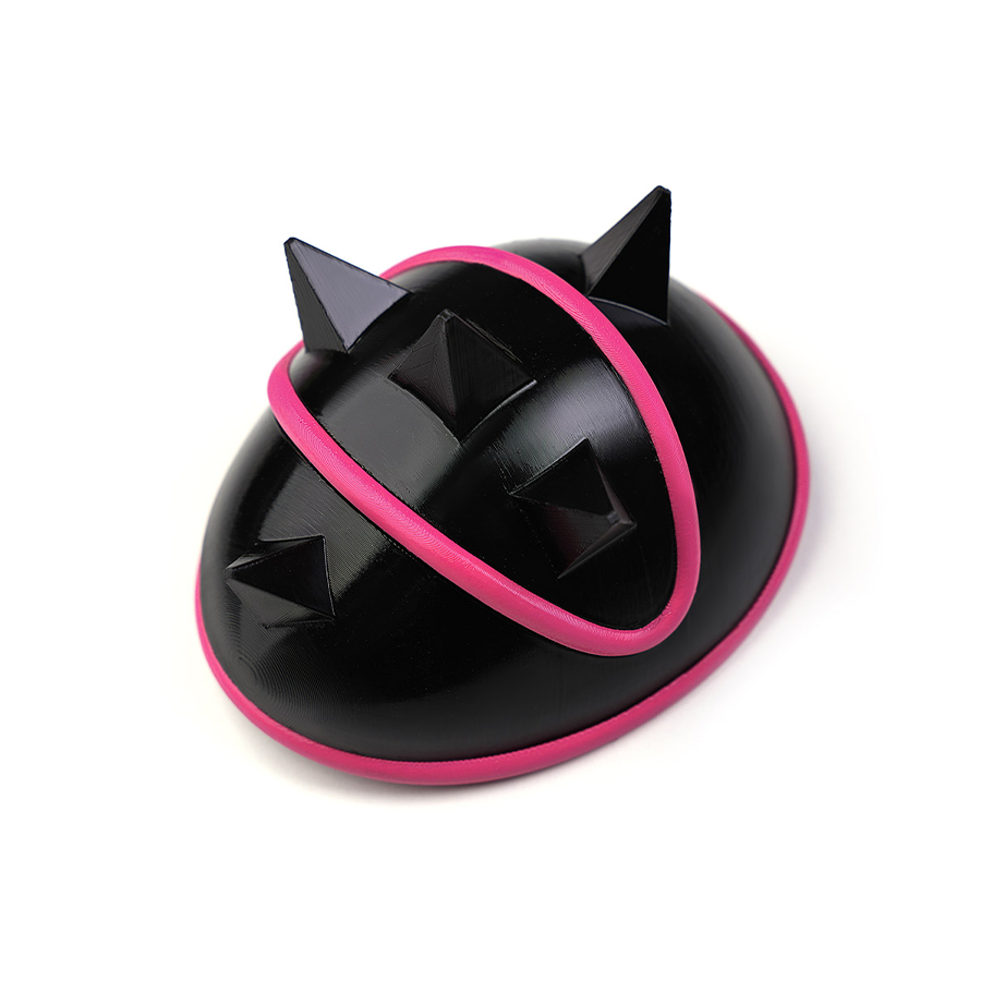 Rumi cosplay costume, black spiked shoulder armor with a pink accent, detail view.