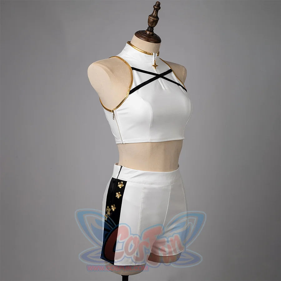 Zippers on the side of the jacket and pants, The top features gold decorative details, two black crisscross straps at the chest area.the pants have black stripes on both sides.