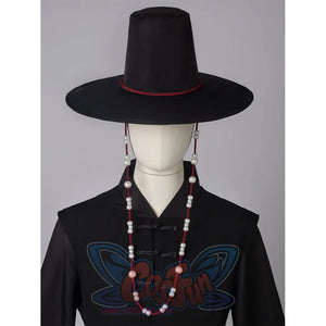 A black high-topped wide-brimmed hat with red strings on both sides, adorned with white round beads.