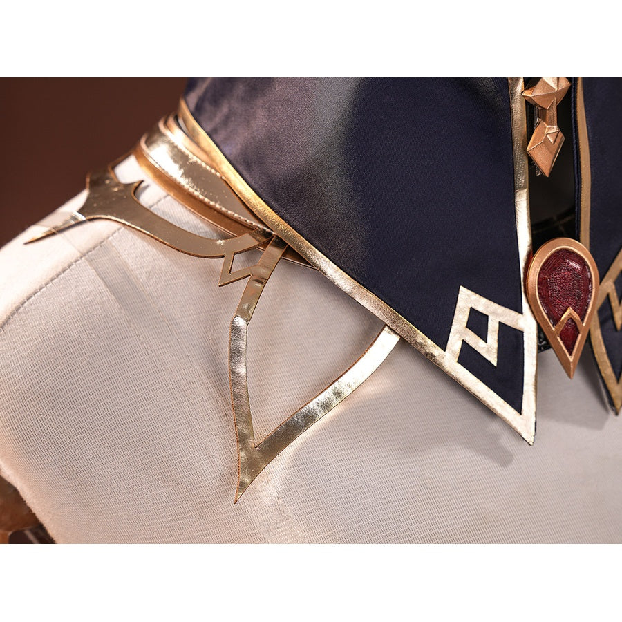 Sandrone cosplay costume chest detail with gold geometric trim, navy collar, and red teardrop gem brooch on white jacket