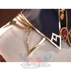 Sandrone cosplay costume chest detail with gold geometric trim, navy collar, and red teardrop gem brooch on white jacket